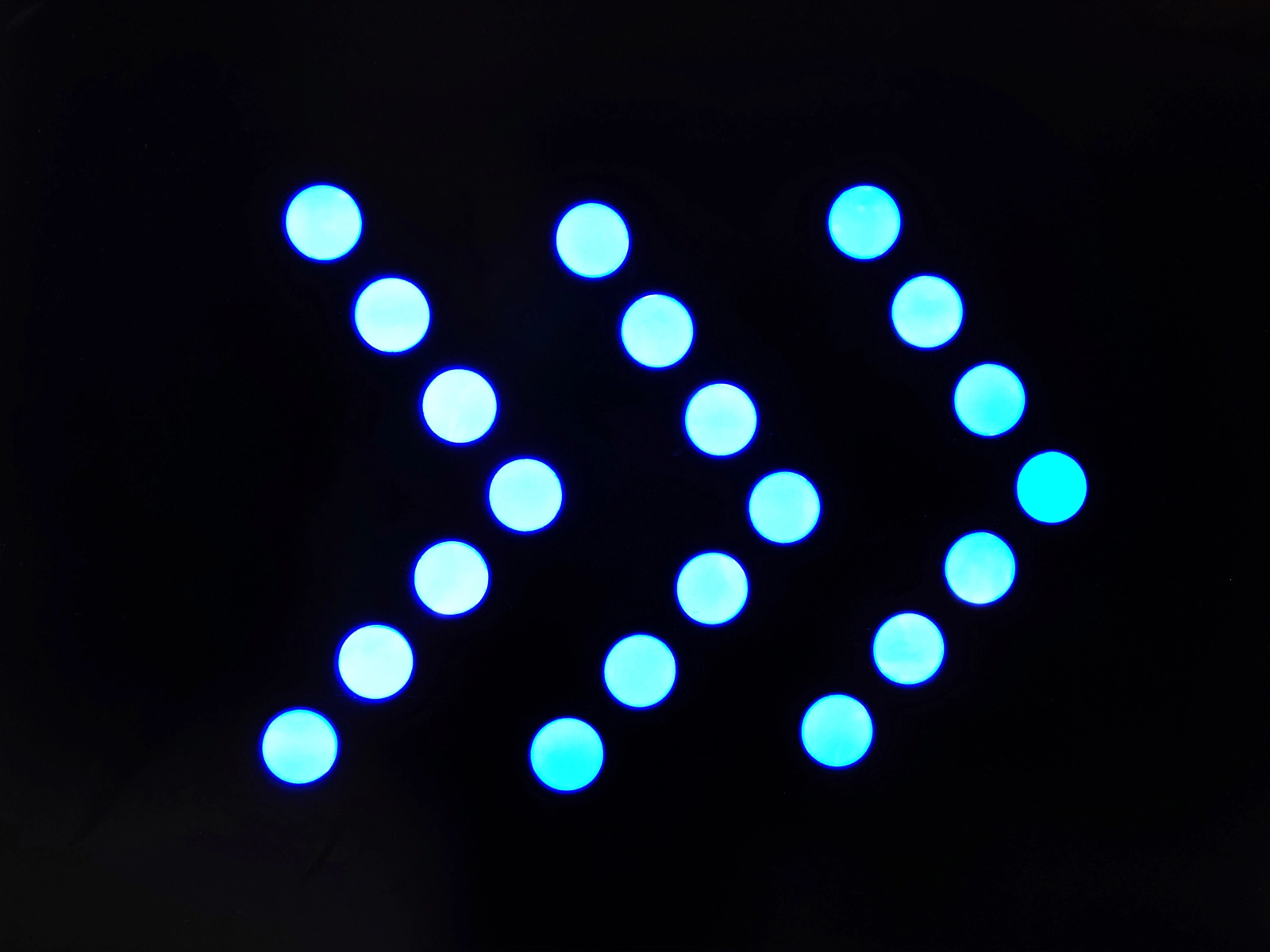 Blue dots illuminated arrow