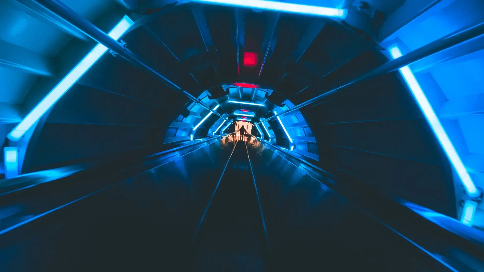 Futuristically illuminated tunnel with blue neon tubes